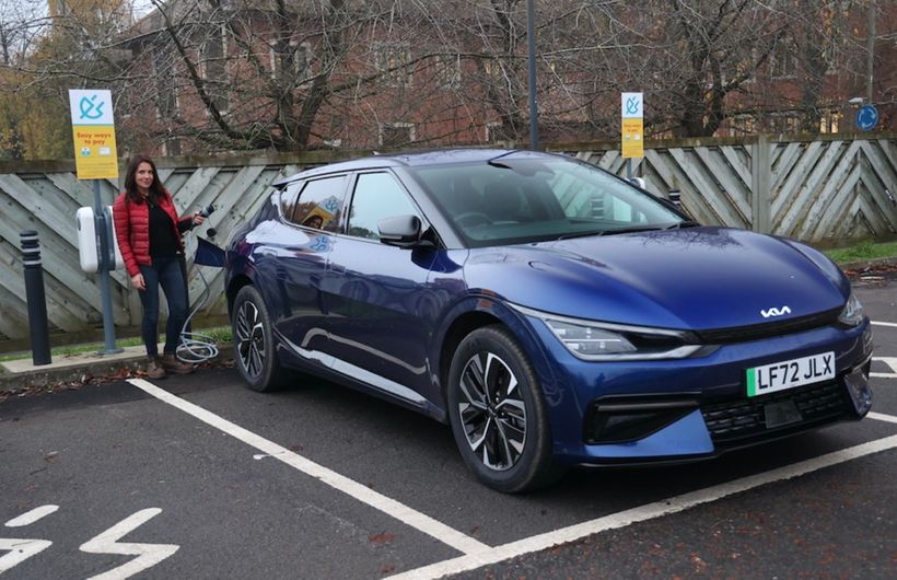 Ginny Buckley plugging an an electric Kia EV6 at a Shell chargepoint